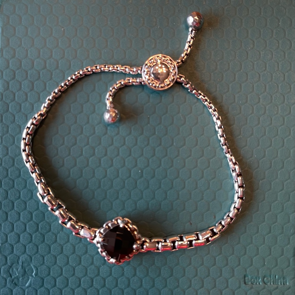 Jai sterling silver adjustable bracelet with dark amethyst gem stone.